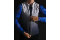 Pale grey deepening to slate grey wind vest with mesh pockets on back
