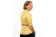 A cycle jersey with a buttercup yellow body with scattered white flowers | Cycling Jersey